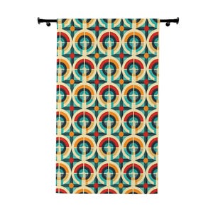 May include: A retro-style curtain with a repeating geometric pattern of circles and squares in shades of teal, orange, red, and cream. The curtain is hanging from a black rod, adding a touch of vintage flair to any room.