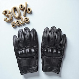 May include: A pair of black leather gloves with perforated details and padded knuckles. The gloves are displayed on a light blue background with the text "30% sale" in gold lettering.