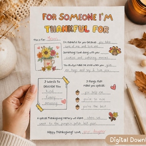 May include: A white paper sheet titled For Someone I'm Thankful For with fill-in-the-blank prompts. It features illustrations of a sunflower bouquet, a turkey, acorns, and autumn leaves. Handwritten text in black ink completes the gratitude prompts.