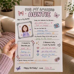 May include: A white paper sheet titled FOR MY AMAZING AUNTIE with colorful hand-drawn illustrations including a butterfly, bow, camera, and flowers. It features fill-in-the-blank sections with handwritten text about why the auntie is loved.