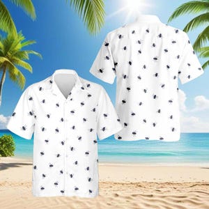 May include: White short-sleeved button-down shirt with a pattern of small, dark blue insects. The shirt is displayed in two views, showcasing the front and back, against a tropical beach background with palm trees and ocean.