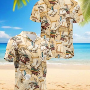 May include: A short-sleeved shirt with a repeating pattern of books, maps, and quills. The shirt is beige with a tropical beach background. The design features stacks of books in various colours and open books.