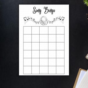 May include: A black and white Song Bingo game sheet. The top of the sheet features the words "Song Bingo" in a script font, along with musical notes and headphones. The sheet is divided into a grid of 25 squares.