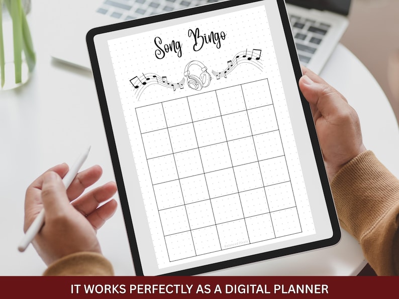 May include: A digital tablet displaying a "Song Bingo" game layout. The design features musical notes, headphones, and a grid for gameplay. The text "Song Bingo" is at the top. The bottom of the image reads "IT WORKS PERFECTLY AS A DIGITAL PLANNER".