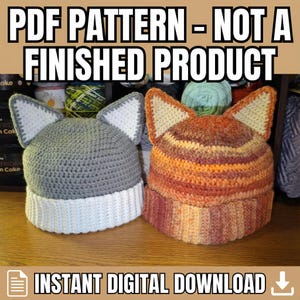 May include: Two crocheted cat ear hats. One is gray with white accents, the other is orange and brown. The hats are displayed on a wooden surface. Text at the top reads "PDF PATTERN - NOT A FINISHED PRODUCT". The bottom text says "INSTANT DIGITAL DOWNLOAD".