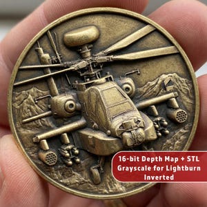 May include: A bronze coin with a detailed relief of a helicopter. The coin has the text "16-bit Depth Map + STL Grayscale for Lightburn Inverted". The helicopter design is set against a mountain backdrop.