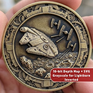 May include: A bronze-coloured coin with a detailed relief of the Millennium Falcon and TIE fighters in a space battle. The coin has a gear-like border and text that reads "16-bit Depth Map + SVG Grayscale for Lightburn Inverted".