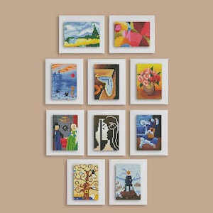 May include: A collection of ten framed cross-stitch artworks. The artworks depict various abstract and landscape scenes, including a mountain, a sunset, and floral arrangements. Each piece is in a white frame.