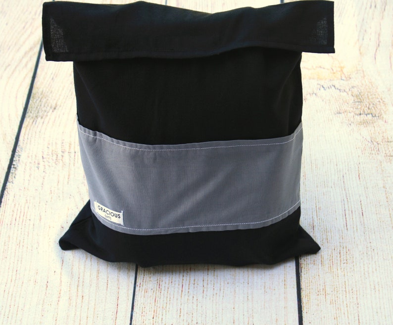 May include: Black fabric storage bag with a gray fabric band and a white label that says "Gracious Gift".