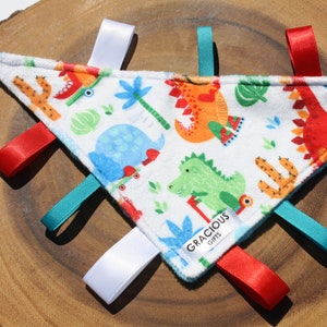Dinosaure sur le thème de patins Minky Tag Triangle Crinkle Toy Blanket