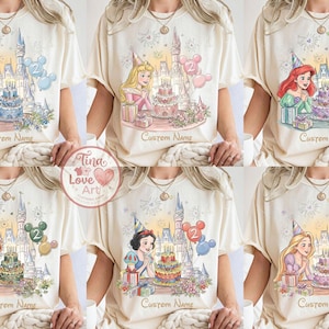 May include: Cream-coloured t-shirts featuring Disney princesses with birthday cake designs, castles, and the text "Custom Name". Each shirt showcases a different princess, including Cinderella, Aurora, Ariel, Merida, Snow White, and Rapunzel.
