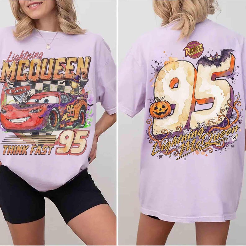 May include: A light purple t-shirt featuring a graphic of Lightning McQueen on the front with the text Lightning MCQUEEN, Cars, and THINK FAST 95. The back displays a large number 95 with a pumpkin, a bat, and the text Rust-eze and Lightning McQueen.