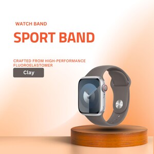 May include: A clay-colored sport watch band made from high-performance fluoroelastomer. The watch has a silver case and a gray face. The band is displayed on a wooden stand. The text on the image says "Watch Band" and "Sport Band".