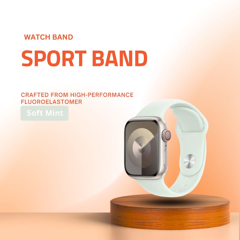 May include: A soft mint sport watch band made of fluoroelastomer. The watch band is displayed on a wooden stand. The text on the image reads "WATCH BAND", "SPORT BAND", "CRAFTED FROM HIGH-PERFORMANCE FLUOROELASTOMER", and "Soft Mint".