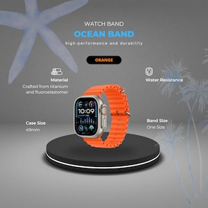 Puede incluir: Reloj Ocean Band naranja con caja de 49 mm. La correa del reloj está hecha de fluoroelastómero y titanio. La esfera del reloj muestra la hora 10:09. El reloj es resistente al agua y es de talla única.