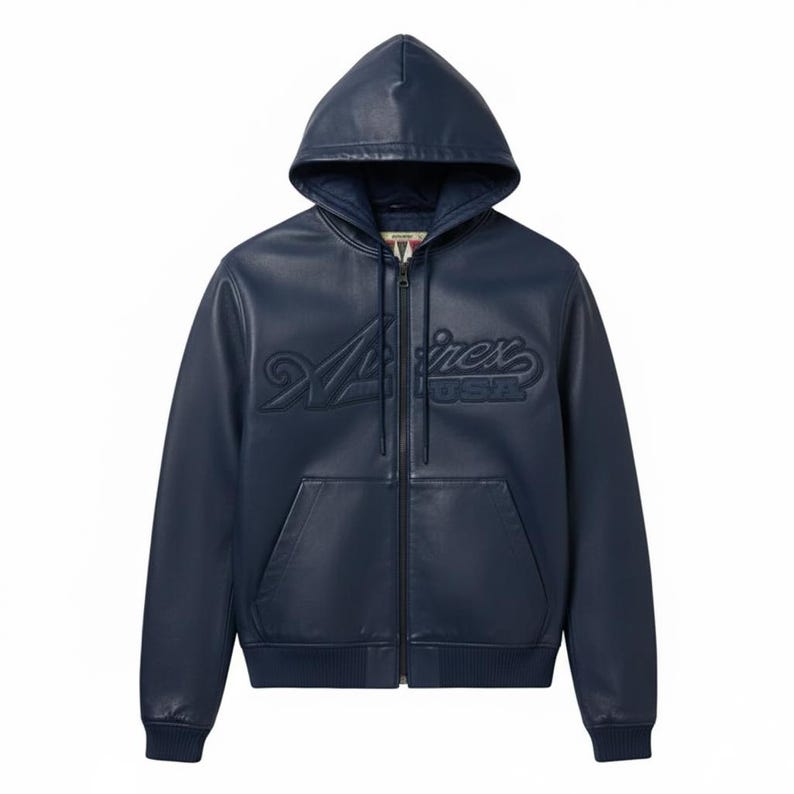 May include: A navy blue leather zip-up hoodie with a hood and front pockets. The jacket features the embossed text "A/V/I/R/E/X USA" across the chest. The jacket has a ribbed hem and cuffs.