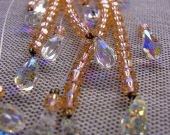 Frangia di perline Swarovski in Peach e Clear.