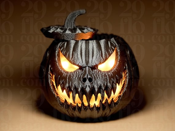 ハロウィンかぼちゃのデコレーション – 恐ろしい顔をした黒くて怖い