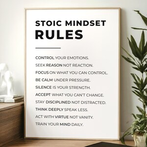 Może przedstawiać: Oprawiony plakat z napisem "STOIC MINDSET RULES" w czarnym kolorze. Poniżej znajduje się lista zasad stoickich w czytelnej czcionce. Plakat jest w jasnej drewnianej ramie, idealny do dekoracji.