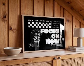 May include: A rectangular framed wall art print featuring a black background with a white bust of Marcus Aurelius, a checkerboard pattern, and bold white text that reads Marcus Aurelius, Confine yourself to the present, Focus on now.