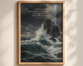 May include: A framed wall art print featuring a dark, stormy seascape with crashing waves against a rocky cliff. The text reads: Be like the promontory, against which the waves continually break, but it stands firm and tames the fury of the water around it. MARCUS AURELIUS.