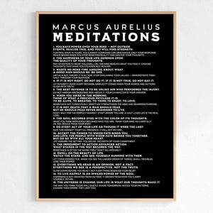 May include: Black framed print featuring the text "Marcus Aurelius Meditations" with 15 philosophical quotes. The print has a light wood frame and is displayed against a white wall.