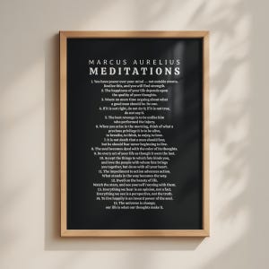 May include: A framed wall art print featuring a black background with white text titled Marcus Aurelius Meditations. The print displays fifteen numbered quotes from the Stoic philosopher in a clean, serif font, encased in a light-toned wooden frame.