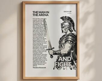 May include: A framed wall art print featuring a black and white illustration of a Roman soldier holding a sword. The text includes the title The Man in the Arena, the full speech by Theodore Roosevelt, and the words Show Up and And Fight.
