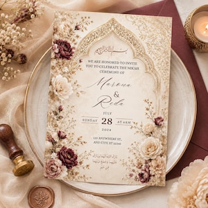 May include: An invitation card for a Nikah ceremony, featuring floral accents in cream, burgundy, and gold. The card includes Arabic calligraphy and English text with the names Maroua & Reda, date, time, and address.
