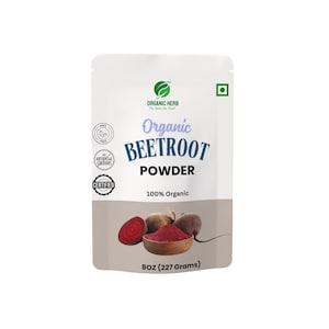 May include: A white pouch of Organic Beetroot Powder. The pouch features the text "Organic Beetroot Powder" and "100% Organic." The bottom of the pouch shows a wooden bowl filled with red powder and sliced beets. The pouch contains 8oz (227 grams).