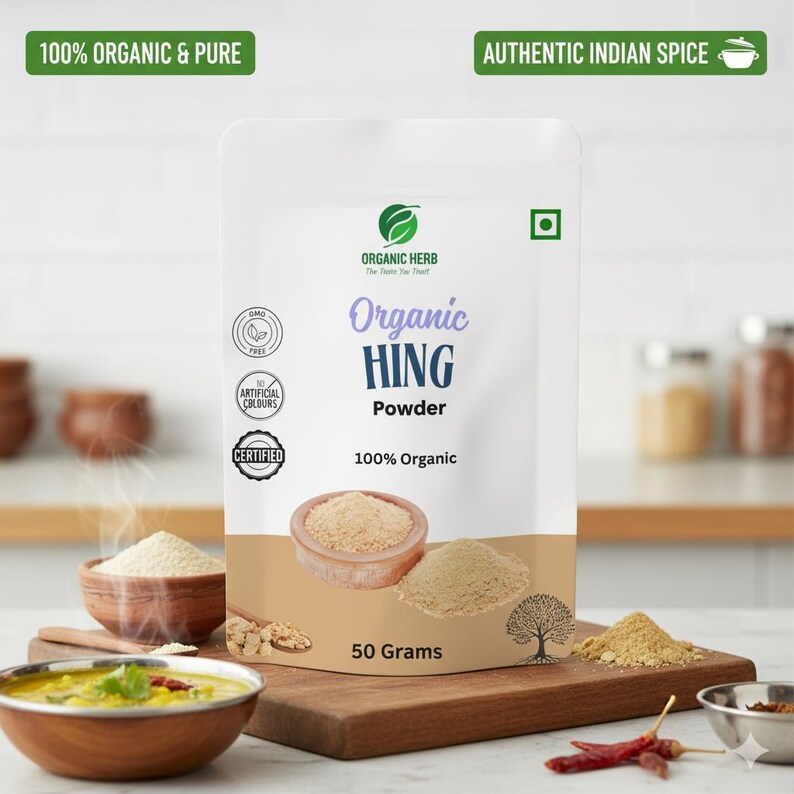 May include: A white packet of "Organic HING Powder" with text that reads "100% Organic & Pure" and "Authentic Indian Spice." The packet is displayed with a wooden bowl of powder, a wooden chopping board, and a bowl of food.