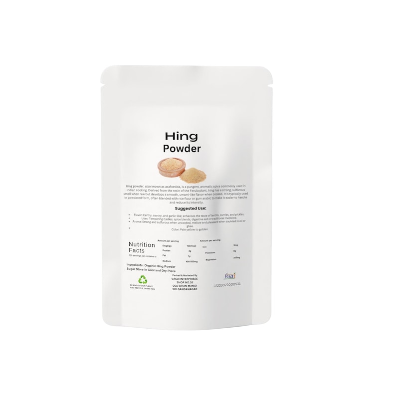 May include: A white packet of Hing Powder, a pungent spice. The packaging displays the product name, an image of the powder, and nutritional details. The text describes the spice's use in Indian cooking.