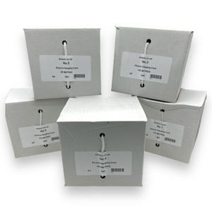 May include: Five white cardboard boxes of picture hanging cord. Each box has a label with text and a white string for hanging. The boxes are labeled with numbers and the length of the cord in meters.