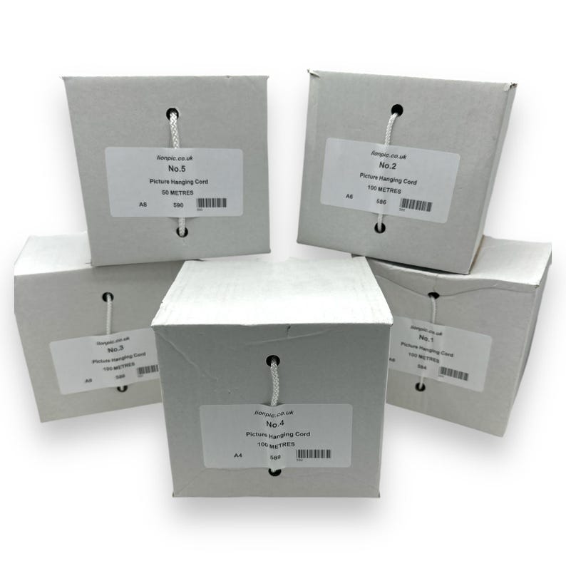 May include: Five white cardboard boxes of picture hanging cord. Each box has a label with text and a white string for hanging. The boxes are labeled with numbers and the length of the cord in meters.