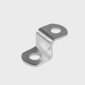 May include: A silver-coloured, bent metal bracket with two circular holes. The bracket has a curved shape, with one hole at each end. The metal has a shiny, reflective surface, and the background is a plain, light grey.