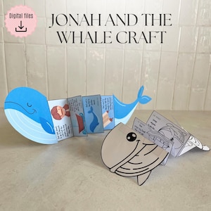 Puede incluir: Una manualidad de papel azul y blanco de una ballena con el texto "Jonah and the Whale Craft". La manualidad incluye una serie de pequeños paneles ilustrados que representan una historia. Un icono rosa de archivos digitales está en la esquina superior izquierda.