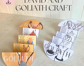 May include: A craft kit with the text "David and Goliath Craft." The kit includes illustrated, semi-circular cards with text and images depicting the biblical story. The cards are in shades of orange, yellow, and white, with black line drawings.