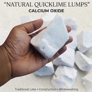 May include: Natural quicklime lumps of calcium oxide, appearing as irregular, matte white rocks. The text at the top reads NATURAL QUICKLIME LUMPS CALCIUM OXIDE, and the text at the bottom reads Traditional Lime • Construction • Whitewashing.