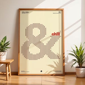 May include: A framed vertical poster with a light cream background featuring a large ampersand symbol constructed from small black 'x' characters. The text 'STILL CHILL' appears at the top left, '001' at the top right, and 'chill' in red.