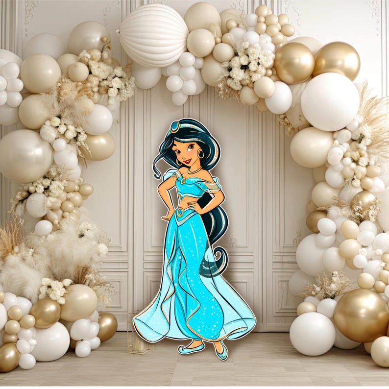 May include: A cutout of a cartoon character with long black hair, wearing a light blue off-the-shoulder top and matching harem pants with gold trim, standing in front of an archway decorated with white, cream, and gold balloons.