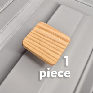 May include: A set of three ceramic mugs with a speckled, matte finish. The mugs are in shades of cream, light gray, and dark gray. Each mug has a simple, minimalist design, perfect for coffee or tea.