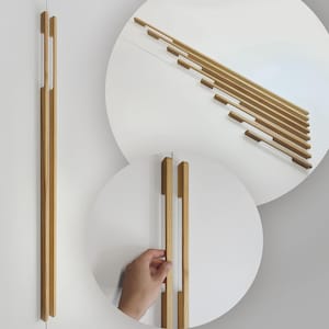 May include: Wooden cabinet pulls in a light brown color. The pulls are long and rectangular, with a modern design. The image also shows a close-up of the pulls on a white cabinet door. The pulls are approximately 12 inches long.