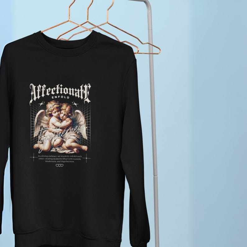Affectionate Black Sweatshirt Featuring Two Hugging Baby Angels  Cute, Heartwarming Design Perfect for Unisex Everyday Wear