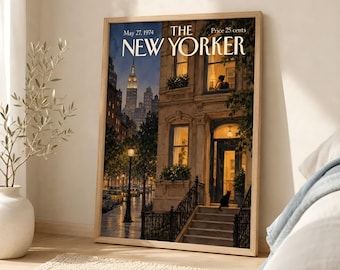 May include: A framed print of The New Yorker magazine cover dated May 27, 1974, featuring a nighttime city street scene with a brownstone building, a black cat on the steps, and the Empire State Building visible in the distance.