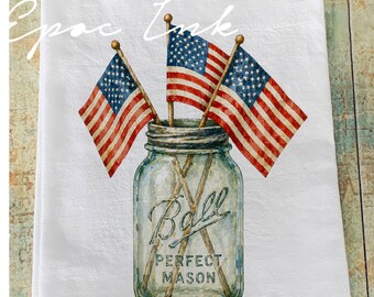 May include: White kitchen towel featuring a watercolor illustration of three American flags in a Ball Perfect Mason jar. The flags have red and white stripes and blue fields with white stars. The jar is clear with the words "Ball PERFECT MASON".