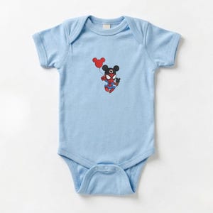 May include: Light blue baby bodysuit featuring a cartoon character combining elements of Spider-Man and Mickey Mouse. The character holds a red balloon. The bodysuit is made of soft material and has short sleeves.