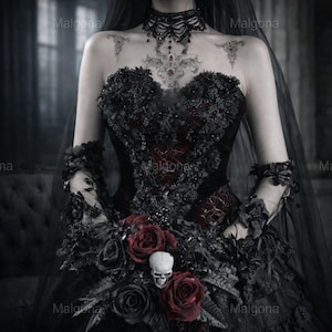 May include: A strapless black corset dress featuring dark floral embellishments, a deep red underlay, and a matching black veil. The ensemble includes a beaded choker, sheer arm sleeves, and a bouquet of dark red roses accented with a white skull.