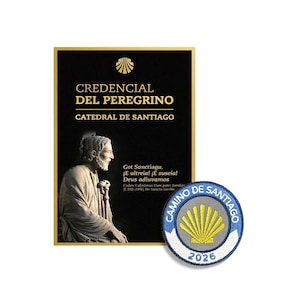 May include: A black rectangular Credencial del Peregrino document from the Catedral de Santiago featuring a gold scallop shell icon, text, and a statue image, alongside a circular embroidered patch with a yellow shell and the text Camino de Santiago 2026.