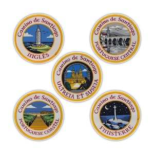 May include: Five round embroidered patches with the words "Camino de Santiago" in a circular design. Each patch features a different image and text: "INGLÉS", "PORTUGUESE CENTRAL", "ULTREIA ET SUSEIA", "PORTUGUESE COASTAL", and "FINISTERRE".