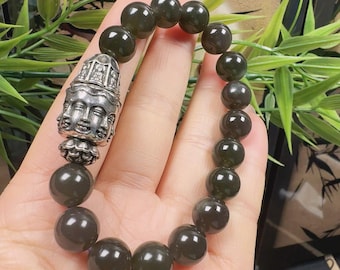Pulsera de cuentas de nefrita natural con centro metálico giratorio y pulsera elástica de jade verde oscuro.